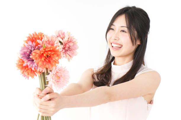 istock woman present flowers 832878116