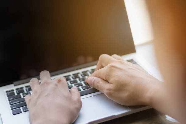 istock Hands typing on laptop in coffee shop 832878146