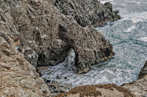 istock Looking down on the Rocks and Ocean Waves 832895622