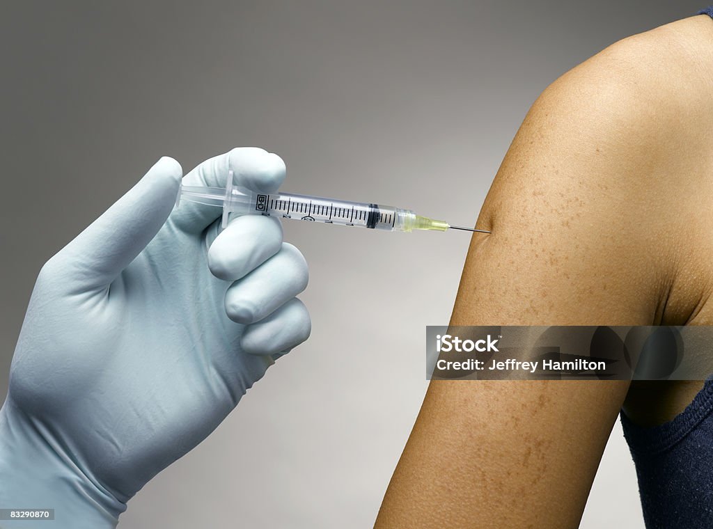 Person receiving a vaccine  Vaccination Stock Photo