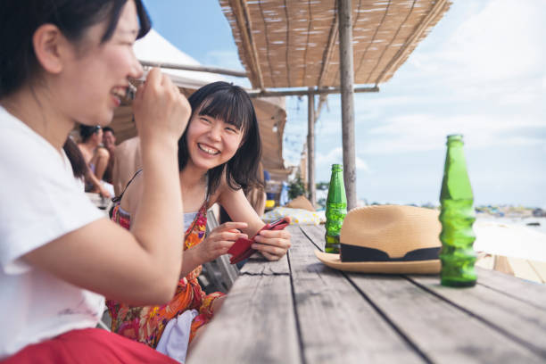 istock Two Women Enjoying Their Time By The Beach 832913114