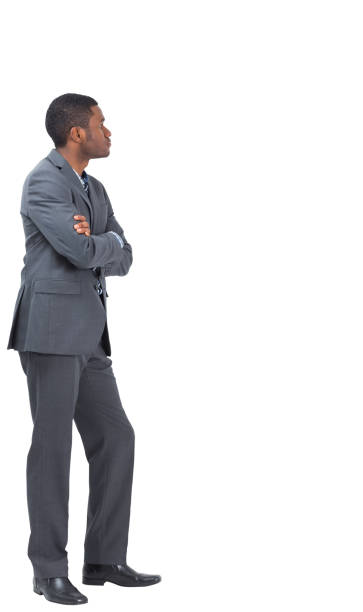 istock Serious businessman standing with his arms folded 832956188