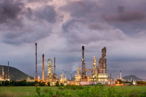 istock Oil refinery plant at cloundy twilight, Storm backgound 832966572