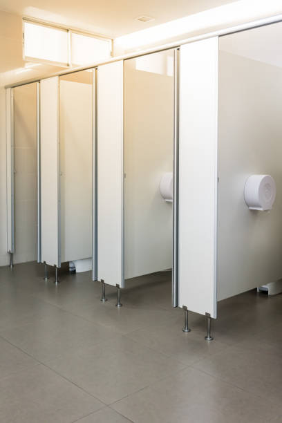 istock Clean public toilet room empty with big window and light from outside 832969348