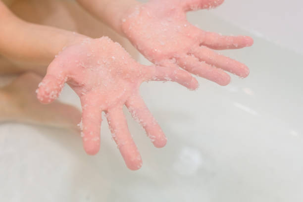 istock Hands with salt Dead Sea in bath 832974974