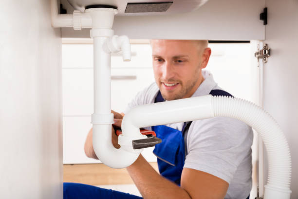 istock Plumber Tightening Sink Pipe 832975990