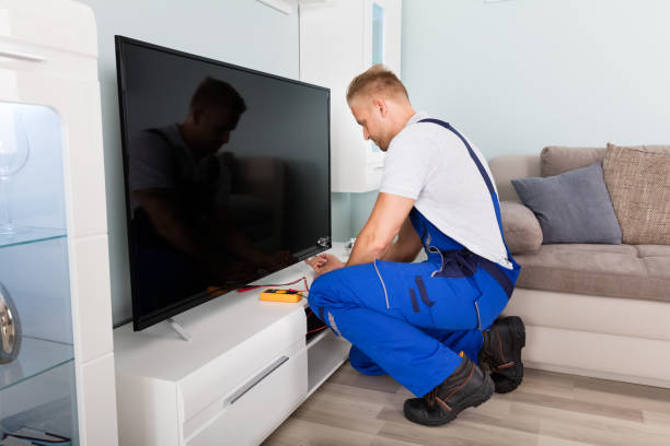 istock Male Electrician Fixing Television 832983444