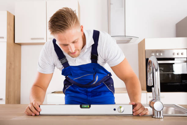 istock Plumber Measuring Level Of A Sink 832983460