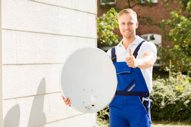 istock Portrait Of A Technician With TV Satellite Dish 832983728