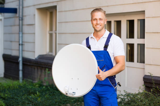 istock Portrait Of A Technician With TV Satellite Dish 832983746