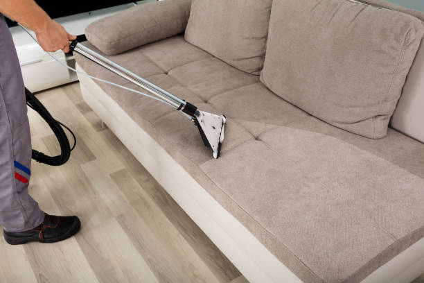 istock Male Worker Cleaning Sofa With Vacuum Cleaner 832990776