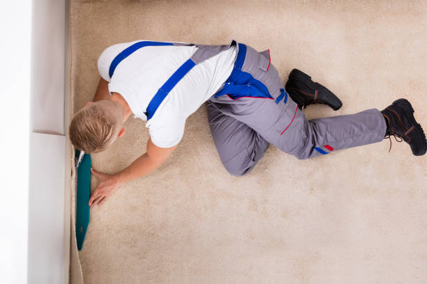 istock Craftsman Fitting Carpet On Floor 832991354