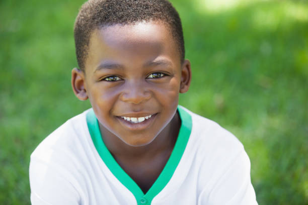 istock Cute boy smiling at the camera in the park 833041956