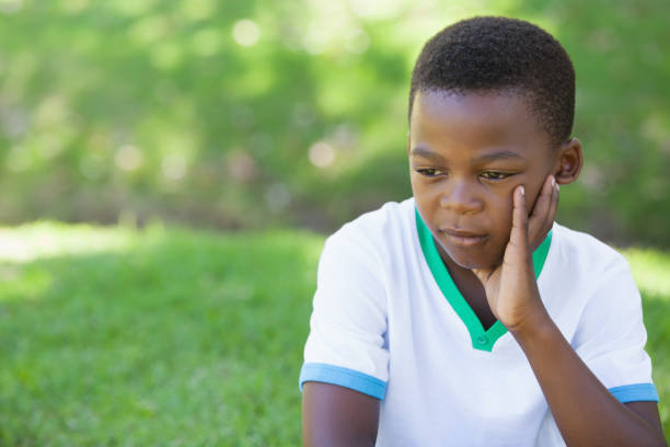 istock Cute upset boy thinking in the park 833042318