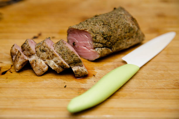 Sliced sous vide pork tenderloin seared with a blowtorch