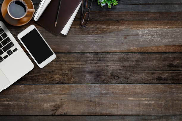 istock Office desk table with laptop, supplies and smartphone . 833056192