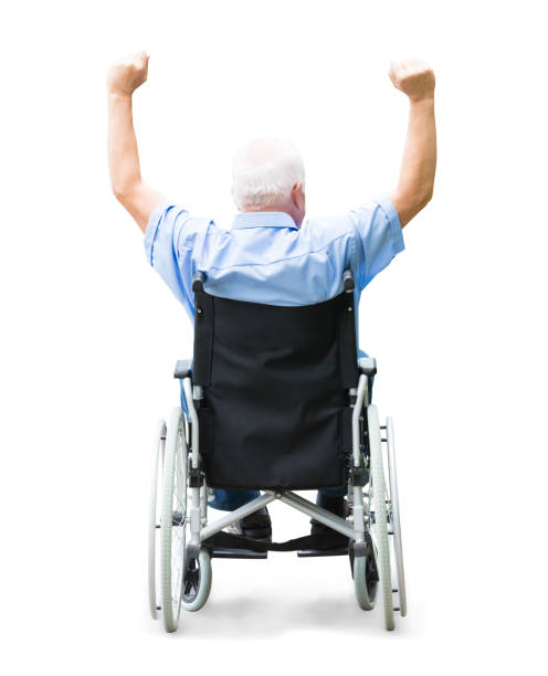 Abstract background. A disabled person in a wheelchair on a city street. Radial zoom blur effect defocusing filter applied, with vintage instagram look.
