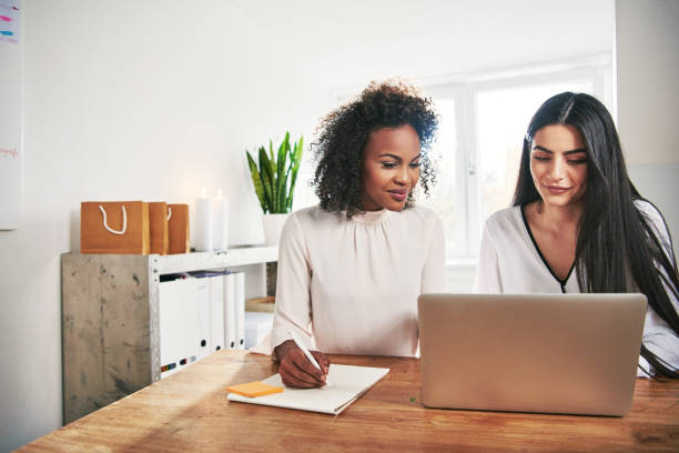 istock Two designers working with laptop in office 833073090