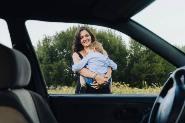 istock Mother with son resting on the meadow  at sunset 833117560