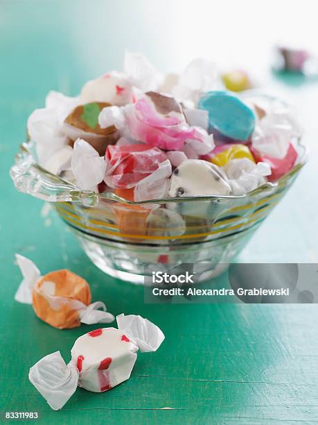 Glass Bowl Of Salt Water Taffy Stock Photo - Download Image Now - Bowl, Candy, Wrapped