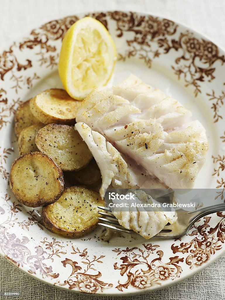 Filet of Cod with pan roasted potatoes  Cod Stock Photo