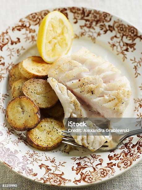 Filet Of Cod With Pan Roasted Potatoes Stock Photo - Download Image Now - Cod, Prepared Potato, Cooked