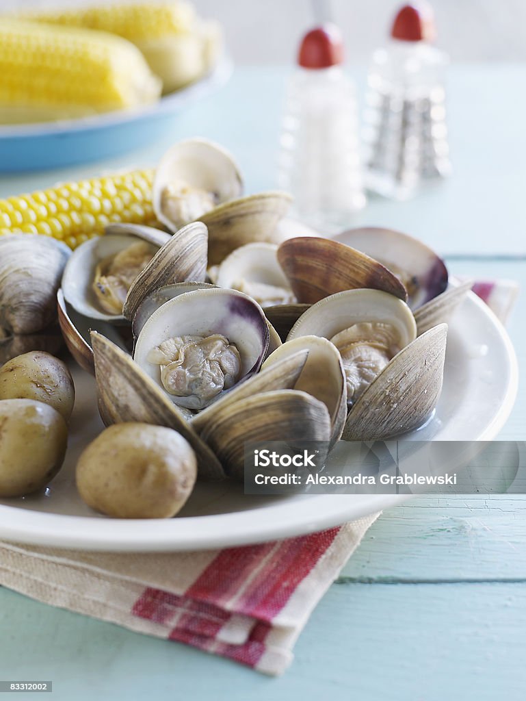 Clam Bake with corn on the cob  Clam - Seafood Stock Photo