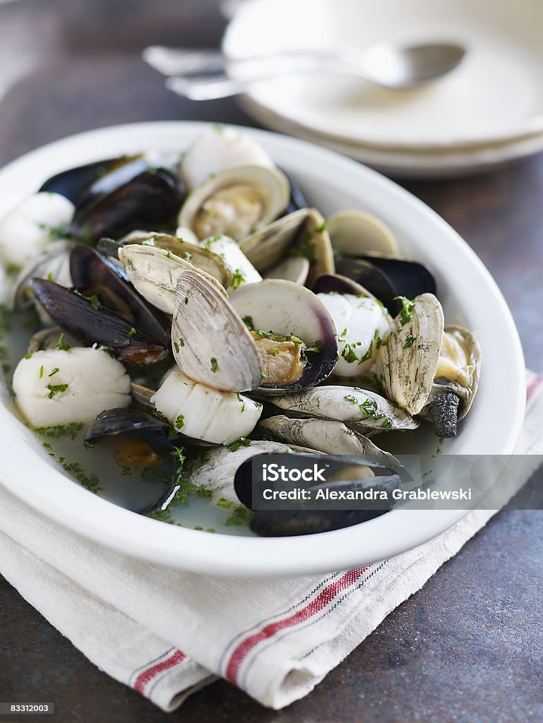 Mussels, scallops, clams in broth  Mussel Stock Photo