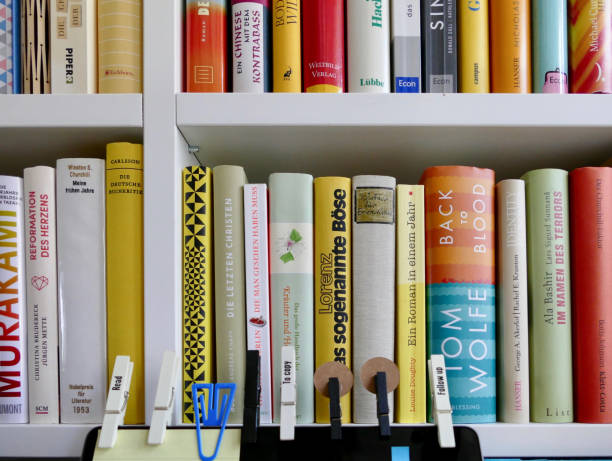 istock Book shelves close up and adhesive notes on screen 833134418