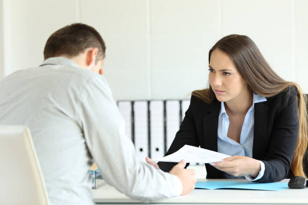 istock Angry boss giving document to a sad employee 833134960