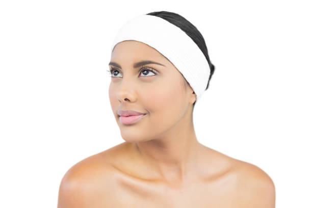 istock Content nude brunette with hairband looking up 833136876