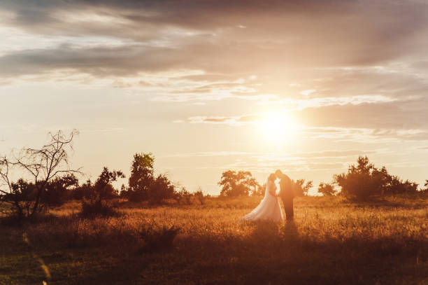 istock Groom and bride on a walk outdoors 833137316