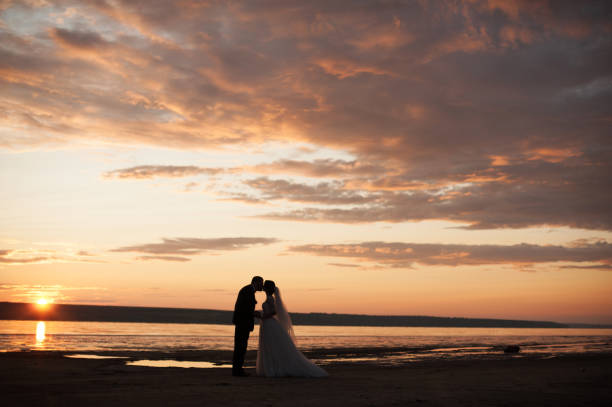 istock Groom and bride on a walk outdoors 833137480