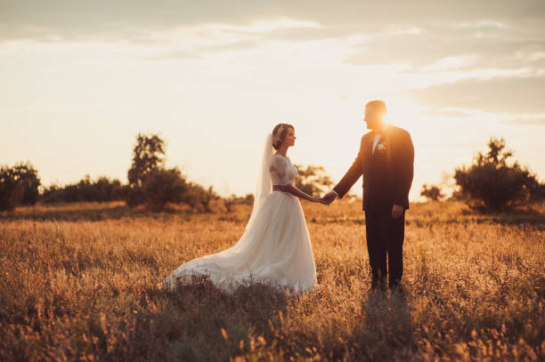 istock Groom and bride on a walk outdoors 833137546