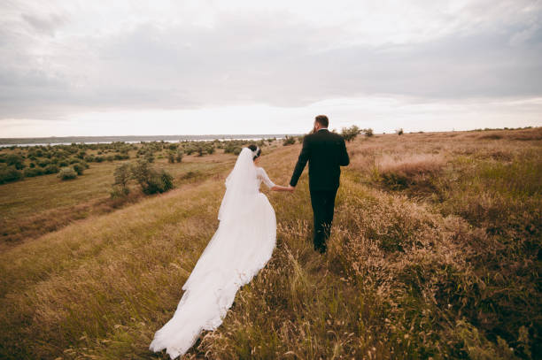 istock Groom and bride on a walk outdoors 833137592