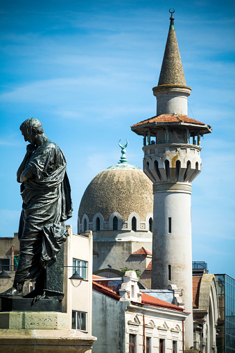 Mosque, dome and statue in the longest-inhabited city of all of Romania