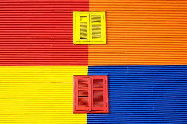 Colorful wall with two windows in La Boca, Buenos Aires