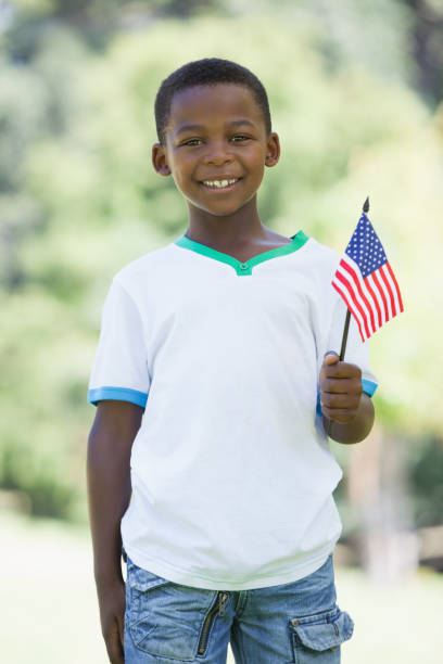 istock Little boy celebrating independence day in the park 833142936