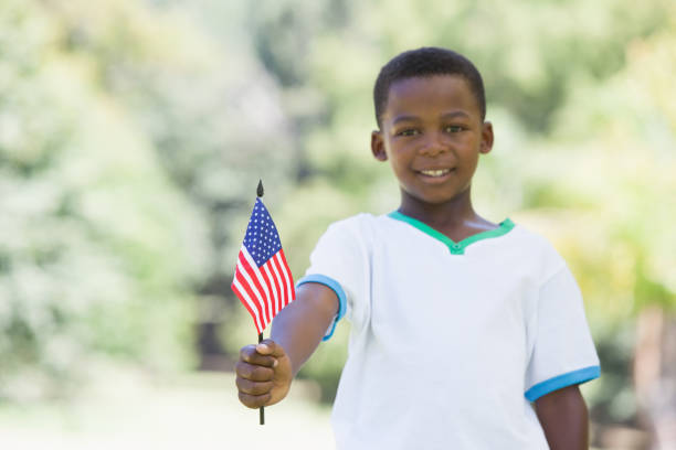 istock Little boy celebrating independence day in the park 833143038