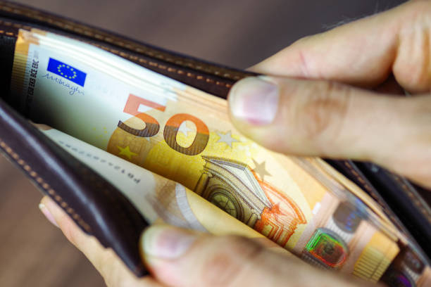 Euros in wallet stock photo