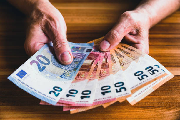 istock Euros in hands of senior 833147756