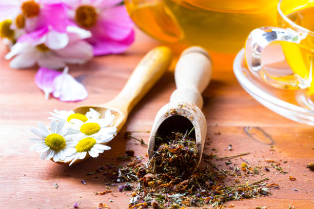 istock Tea herbs healing chamomile wooden background 833148802