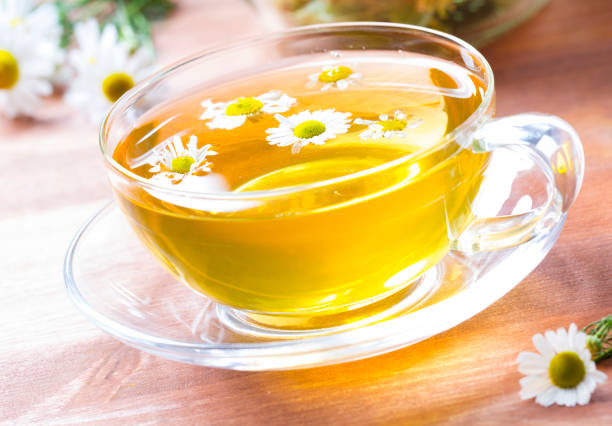 istock Tea herbs healing chamomile wooden background 833149316