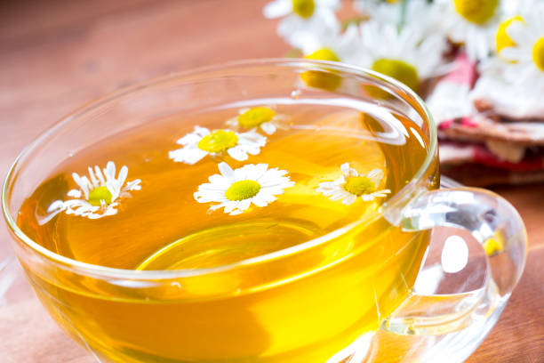 istock Tea herbs healing chamomile wooden background 833150126