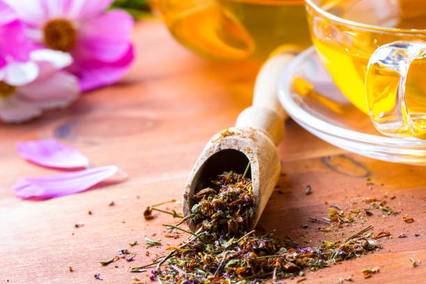istock Tea herbs healing chamomile wooden background 833150844