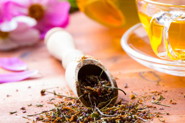 istock Tea herbs healing chamomile wooden background 833151100