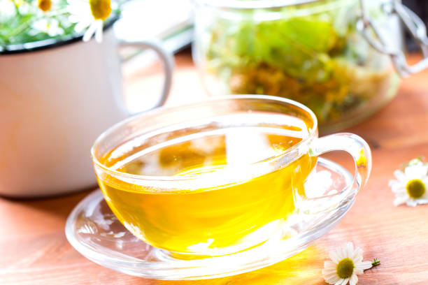 istock Tea herbs healing chamomile wooden background 833153476