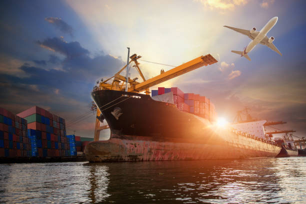 istock Logistics and transportation of Container Cargo ship and Cargo plane with working crane bridge in shipyard at sunset 833154490