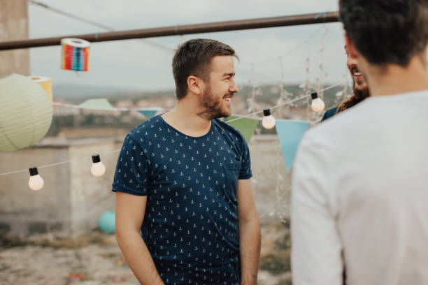 istock Bearded man enjoys the party on the roof 833154514