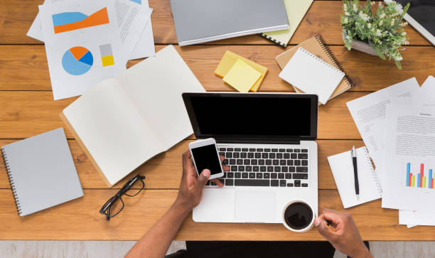 istock African-american businessman at work, table top view 833154554